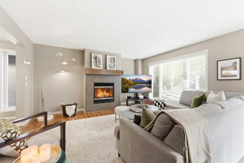 39 Evercreek Bluffs Road Sw, Calgary, AB - Indoor With Fireplace