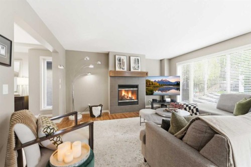 39 Evercreek Bluffs Road Sw, Calgary, AB - Indoor Photo Showing Living Room With Fireplace