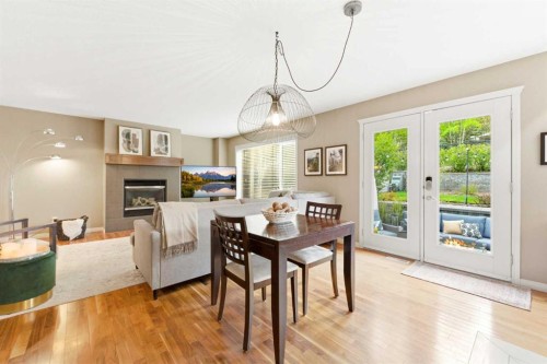 39 Evercreek Bluffs Road Sw, Calgary, AB - Indoor Photo Showing Other Room With Fireplace