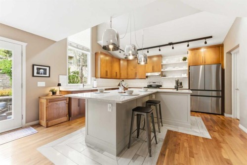 39 Evercreek Bluffs Road Sw, Calgary, AB - Indoor Photo Showing Kitchen With Upgraded Kitchen