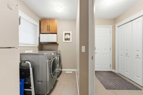 39 Evercreek Bluffs Road Sw, Calgary, AB - Indoor Photo Showing Laundry Room