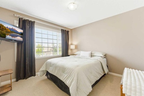 39 Evercreek Bluffs Road Sw, Calgary, AB - Indoor Photo Showing Bedroom