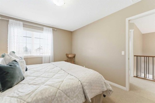 39 Evercreek Bluffs Road Sw, Calgary, AB - Indoor Photo Showing Bedroom