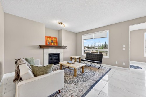 71 Walden Manor Se, Calgary, AB - Indoor Photo Showing Living Room With Fireplace