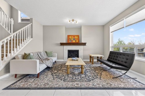 71 Walden Manor Se, Calgary, AB - Indoor Photo Showing Living Room With Fireplace