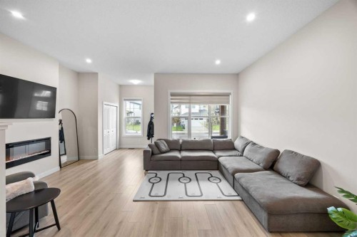 72 Seton Villas Se, Calgary, AB - Indoor Photo Showing Living Room With Fireplace
