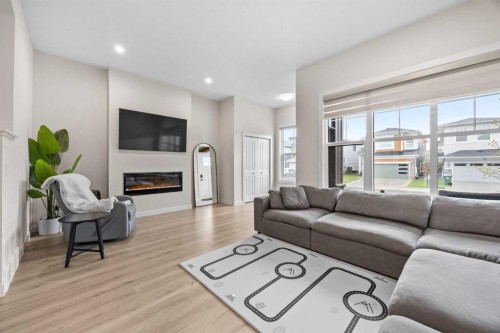 72 Seton Villas Se, Calgary, AB - Indoor Photo Showing Living Room With Fireplace