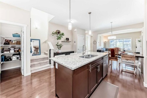 199 River Heights Green, Cochrane, AB - Indoor Photo Showing Kitchen With Double Sink