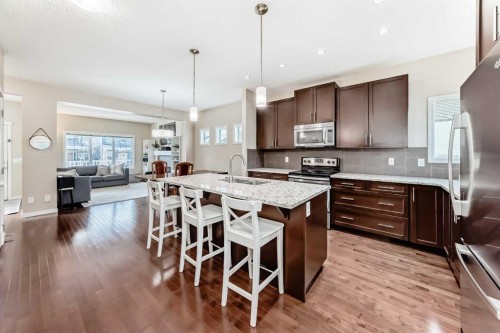199 River Heights Green, Cochrane, AB - Indoor Photo Showing Kitchen With Upgraded Kitchen
