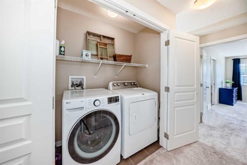 199 River Heights Green, Cochrane, AB - Indoor Photo Showing Laundry Room