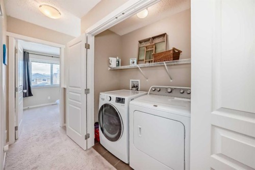 199 River Heights Green, Cochrane, AB - Indoor Photo Showing Laundry Room