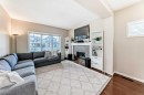 199 River Heights Green, Cochrane, AB  - Indoor Photo Showing Living Room With Fireplace 