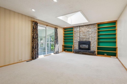 40 Varston Place Nw, Calgary, AB - Indoor With Fireplace