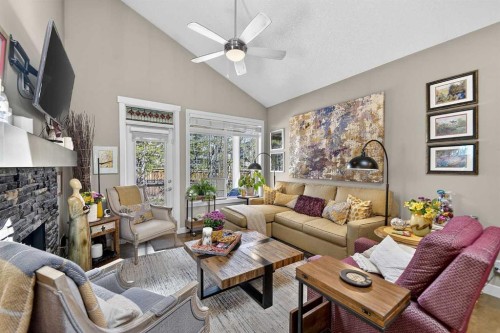 43 Cortina Villas Sw, Calgary, AB - Indoor Photo Showing Living Room With Fireplace