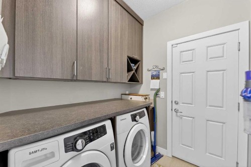 43 Cortina Villas Sw, Calgary, AB - Indoor Photo Showing Laundry Room
