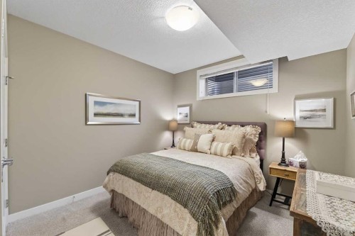 43 Cortina Villas Sw, Calgary, AB - Indoor Photo Showing Bedroom