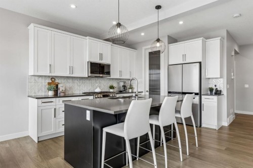 363 Precedence Hill, Cochrane, AB - Indoor Photo Showing Kitchen With Upgraded Kitchen
