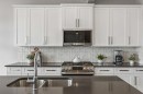 363 Precedence Hill, Cochrane, AB  - Indoor Photo Showing Kitchen With Double Sink With Upgraded Kitchen 