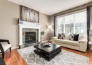 124 Copperfield Green Se, Calgary, AB  - Indoor Photo Showing Living Room With Fireplace 