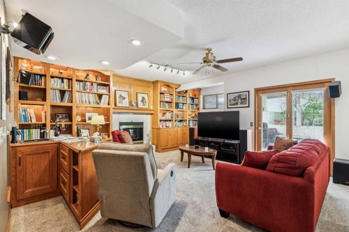 47 Sunlake Close Se, Calgary, AB - Indoor Photo Showing Living Room With Fireplace