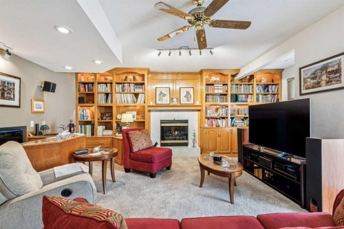 47 Sunlake Close Se, Calgary, AB - Indoor Photo Showing Living Room With Fireplace