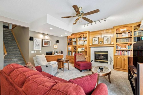 47 Sunlake Close Se, Calgary, AB - Indoor Photo Showing Living Room With Fireplace