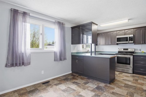 4525 Shannon Drive, Olds, AB - Indoor Photo Showing Kitchen With Double Sink