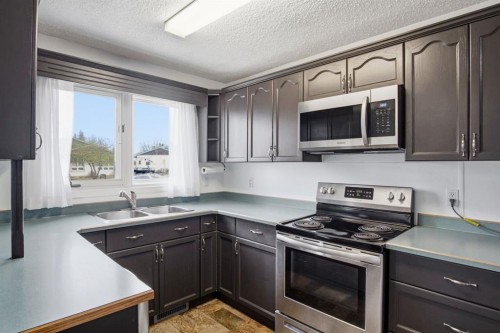 4525 Shannon Drive, Olds, AB - Indoor Photo Showing Kitchen With Double Sink