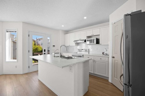 176 Arbour Grove Close Nw, Calgary, AB - Indoor Photo Showing Kitchen With Double Sink With Upgraded Kitchen