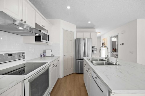 176 Arbour Grove Close Nw, Calgary, AB - Indoor Photo Showing Kitchen With Double Sink With Upgraded Kitchen