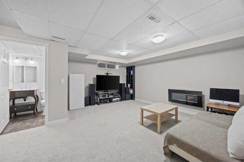 176 Arbour Grove Close Nw, Calgary, AB - Indoor With Fireplace