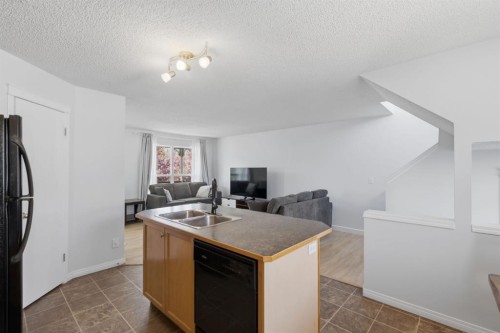 80 Prestwick Bay Se, Calgary, AB - Indoor Photo Showing Kitchen With Double Sink