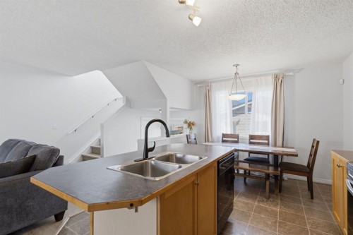 80 Prestwick Bay Se, Calgary, AB - Indoor Photo Showing Kitchen With Double Sink