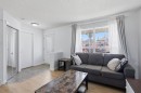 80 Prestwick Bay Se, Calgary, AB  - Indoor Photo Showing Living Room 