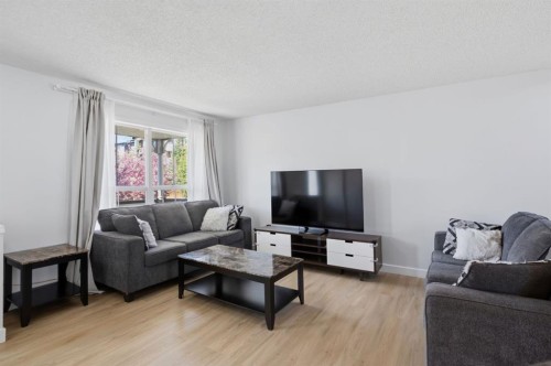 80 Prestwick Bay Se, Calgary, AB - Indoor Photo Showing Living Room