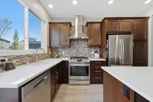 58 Kingfisher Crescent Se, Airdrie, AB - Indoor Photo Showing Kitchen With Stainless Steel Kitchen With Double Sink With Upgraded Kitchen