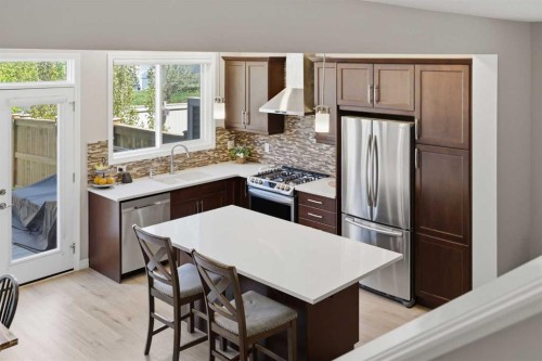 58 Kingfisher Crescent Se, Airdrie, AB - Indoor Photo Showing Kitchen With Stainless Steel Kitchen With Upgraded Kitchen
