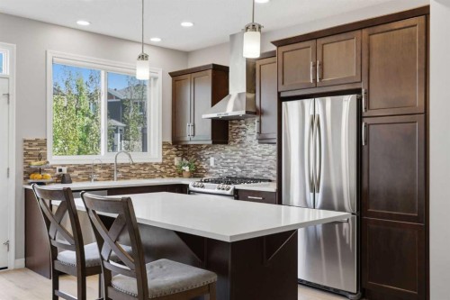 58 Kingfisher Crescent Se, Airdrie, AB - Indoor Photo Showing Kitchen With Stainless Steel Kitchen With Upgraded Kitchen