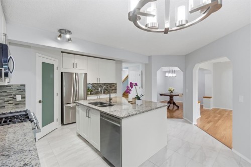 128 Valley Brook Circle Nw, Calgary, AB - Indoor Photo Showing Kitchen With Double Sink With Upgraded Kitchen