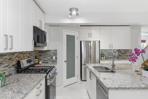 128 Valley Brook Circle Nw, Calgary, AB - Indoor Photo Showing Kitchen With Double Sink With Upgraded Kitchen