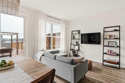 77 Magnolia Heath Se, Calgary, AB - Indoor Photo Showing Living Room