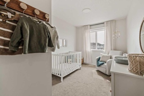 77 Magnolia Heath Se, Calgary, AB - Indoor Photo Showing Bedroom