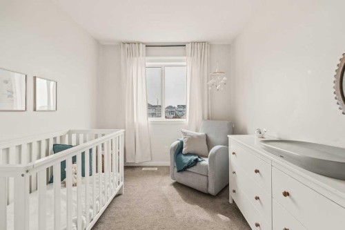 77 Magnolia Heath Se, Calgary, AB - Indoor Photo Showing Bedroom