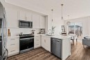 77 Magnolia Heath Se, Calgary, AB  - Indoor Photo Showing Kitchen With Stainless Steel Kitchen With Upgraded Kitchen 