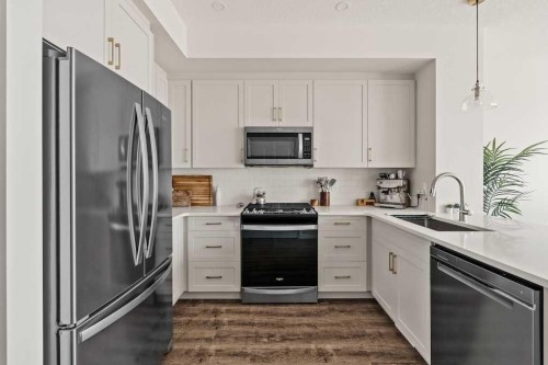 77 Magnolia Heath Se, Calgary, AB - Indoor Photo Showing Kitchen With Stainless Steel Kitchen With Upgraded Kitchen