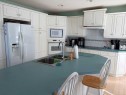 1065 East Chestermere Drive, Chestermere, AB  - Indoor Photo Showing Kitchen With Double Sink 