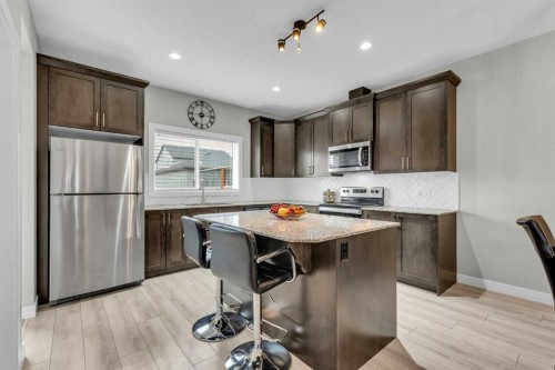 114 Hillcrest Close Sw, Airdrie, AB - Indoor Photo Showing Kitchen With Stainless Steel Kitchen With Upgraded Kitchen