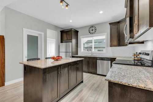 114 Hillcrest Close Sw, Airdrie, AB - Indoor Photo Showing Kitchen With Upgraded Kitchen