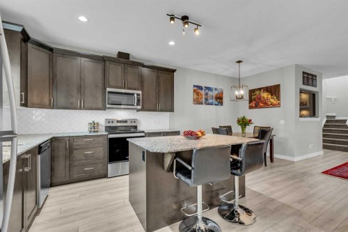 114 Hillcrest Close Sw, Airdrie, AB - Indoor Photo Showing Kitchen With Stainless Steel Kitchen With Upgraded Kitchen