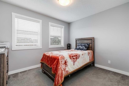 114 Hillcrest Close Sw, Airdrie, AB - Indoor Photo Showing Bedroom